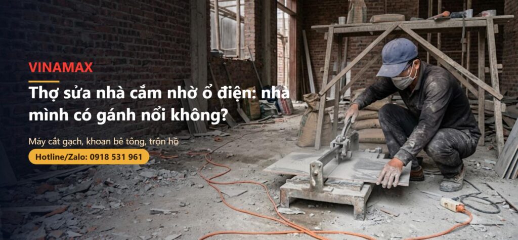 Nhà đang sửa, thợ dùng máy cắt gạch, dây nối dài kéo ngang nền xi măng